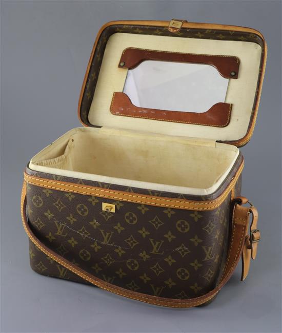 A Louis Vuitton vanity case with tan leather shoulder strap length 33cm